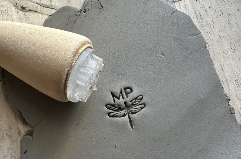 Personalized pottery stamp with initials and dragonfly