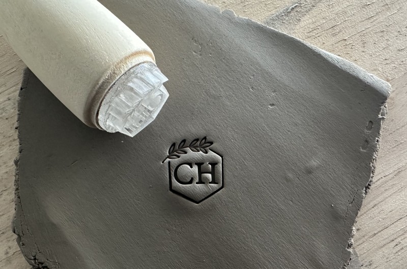 Personalized pottery stamp with initials and hexagon