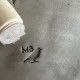 Personalized pottery stamp with initials and bird