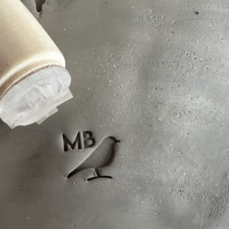 Personalized pottery stamp with initials and bird