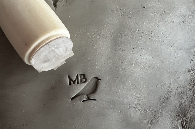 Personalized pottery stamp with initials and bird