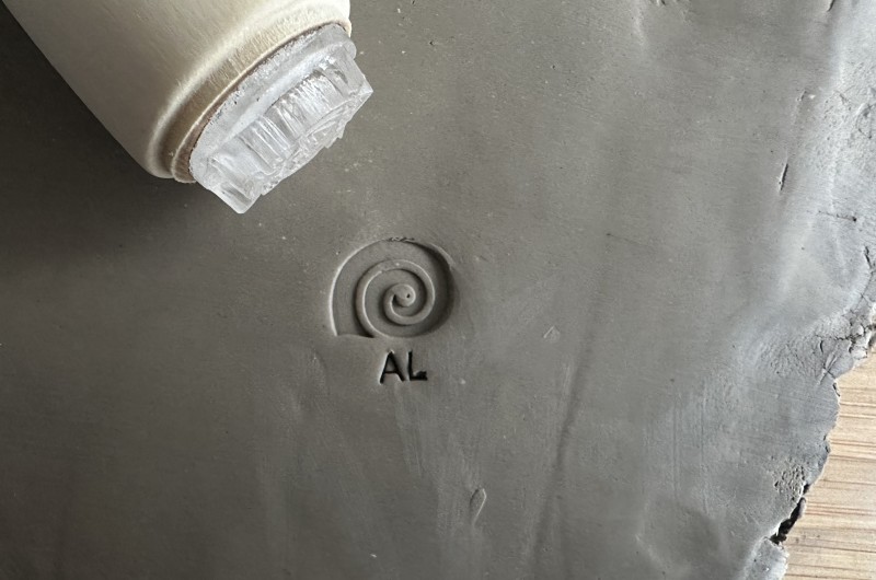 Personalized pottery stamp with initials and bee