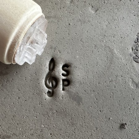 Personalized pottery stamp with initials and music