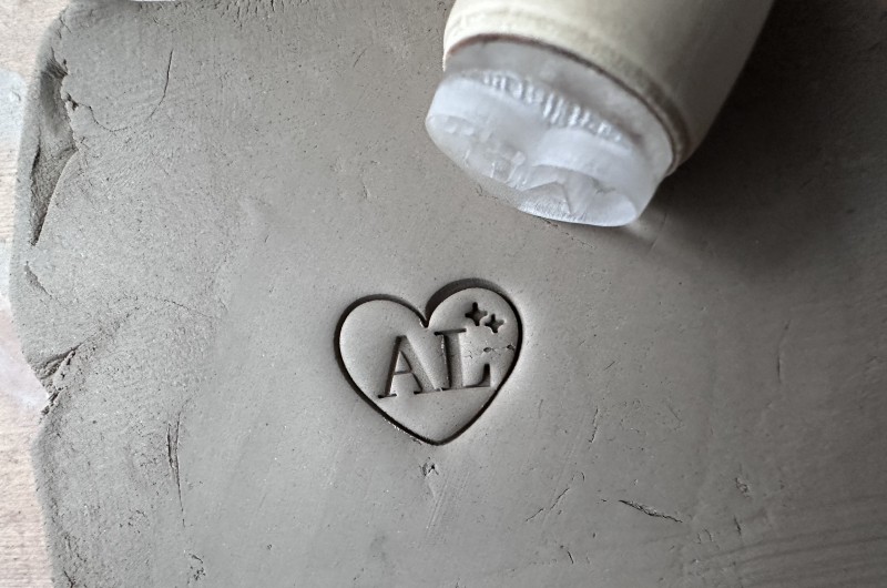 Personalized pottery stamp with initials and starry heart