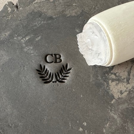 Personalized pottery stamp with initials and laurel wreath