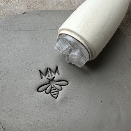 Personalized pottery stamp with initials and bee