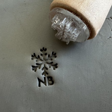 Personalized pottery stamp with initials and snowflake